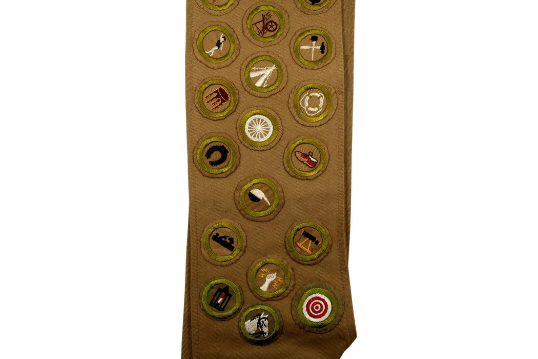 Merit Badge Sash 1930s - 1940s with 25 Wide Tan and 5 Tan Crimped and 2 Khaki Crimped Merit Badges on 1930s Tan