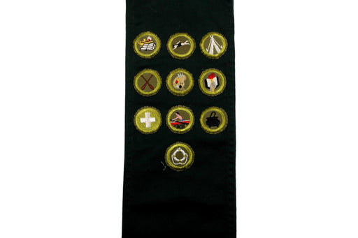 Merit Badge Sash 1950s with 10 Kahki Crimped Merit Badges on Explorer Green